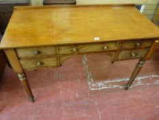 A REGENCY MAHOGANY WRITING TABLE, the rectangular top with shallow back rail over a long central