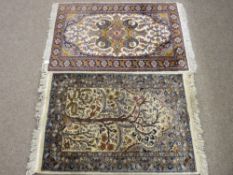 TWO SMALL EASTERN WOVEN WOOLLEN CARPETS, one having central bird and tree pattern with repeating