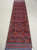 A MESHWANI RUNNER, single bordered with central double diamond repeating pattern on a blue and red