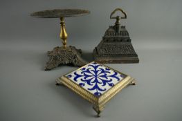 A CAST IRON DOORSTOP & KETTLE STAND with a teapot stand, the doorstop stamped 'A Kenrick & Sons, No.