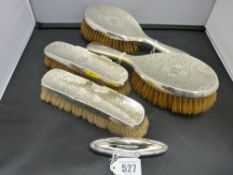 Four silver backed dressing table brushes, Chester hallmark along with a nail buffer holder