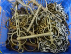 Plastic crate of heavy horse and other lead chain, bits and brasswork