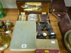 Cased set of fish knives and forks, pair of vintage binoculars and a compass, an 'Animal World'
