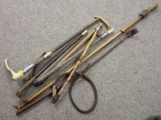 Collection of riding crops and whips, some having silver/white metal mounts