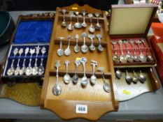 Quantity of collector's spoons and displays along with two cased sets