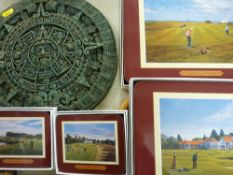 Four boxed quantities of placemats with golfing scenes and an Aztec style composition wall ornament