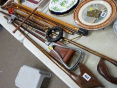 Folding shooting stick, a selection of carved walking canes and sticks etc