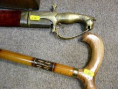 Ornamental sword with lion handle and scabbard and a walking stick
