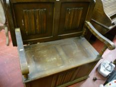 Vintage oak monk's bench with linenfold carving