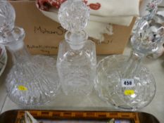 Two glass ship's decanters and one other