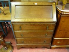 Clean vintage oak fall front bureau with shaped lower apron