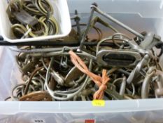 Plastic crate of predominantly horse bits and stirrups etc