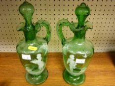 Pair of green Mary Gregory style carafes with stoppers (some damage)