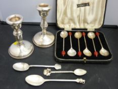 Cased set of cocoa bean spoons, three collector's teaspoons and two small loaded candlesticks, all