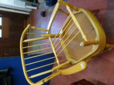 Light wood Ercol style stick back armchair and matching coffee table with under tier shelf