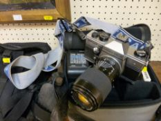 Praktica MTL5B SLR camera with additional lens and associated equipment in carry case