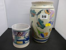 Colourful Art Deco vase by Honiton and a bird decorated jam pot holder by Carter Stabler Adams