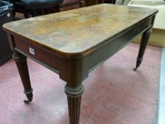 Edwards & Roberts walnut side table on fluted supports with brass cup and castors, applied maker's