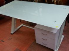 Stylish glass topped computer work table with a lower three drawer storage chest