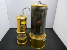 Vintage style brass miner's lamp and a heater