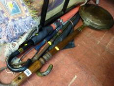 Wooden handled copper warming pan and a quantity of vintage brollies