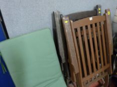 Two hardwood garden recliners with cushions