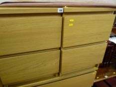 Pair of narrow chests of drawers, a matching three long drawer chest and a cast metal double bed