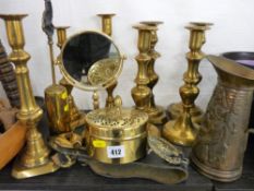 Pair of circular based brass candlesticks with five other square based examples and horse brasses