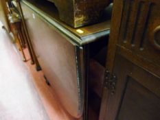 Good sized polished gate leg table on reed supports