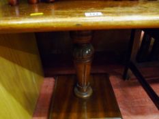 Single pedestal square topped coffee table