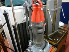 Dyson DC071 bagless vacuum cleaner and a modern standard lamp E/T