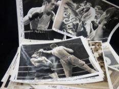 Collection of boxing and cricket photographic stills with written captions and indicators for the