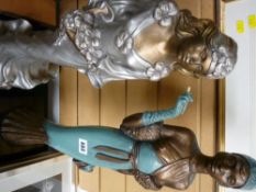 Two large decorative lady figurines