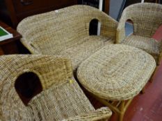 Compact cane four piece conservatory suite comprising sofa, two chairs and a coffee table
