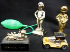 Two Pboy figurines, a small model of a locomotive and a vintage car