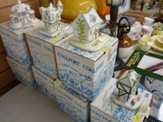 Seven boxed Coalport cottages
