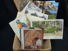 Collection of loose vintage postcards and photographs