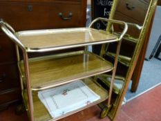 Brass effect tea trolley and a gilt framed bevelled wall mirror