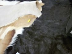 Quantity of animal skin rugs