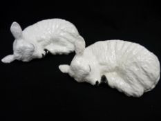 Shebeg I.O.M. - two sleeping pottery figures of lambs, signed to the base S Kelly, one dated 1979