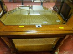 Hexagonal glass topped table with lower cane section