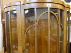 Serpentine front glazed china cabinet