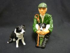 Shebeg I.O.M. - pottery figure of a seated shepherd with dog with an additional collie figure