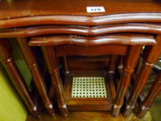 Nest of three modern coffee tables, one with cane base