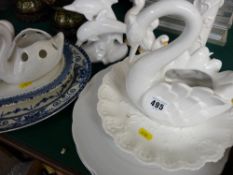 Quantity of swan and other bird ornamental figurines with a selection of decorative wall plates