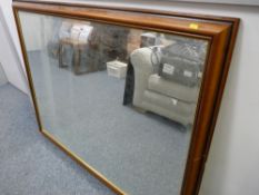 Large wooden framed bevelled wall mirror