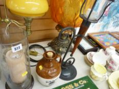Cut glass storm candleholder, wrought iron candleholder and a stoneware whisky jug
