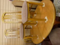 Extending dining table by McIntosh (extender underneath sliding leaves) and a set of six dining