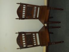 Pair of Victorian oak hall chairs, turned finials,