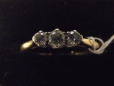 18 carat gold diamond ring with 3 central diamonds